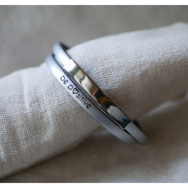 Metalen staafarmband in leer, dubbele draai 