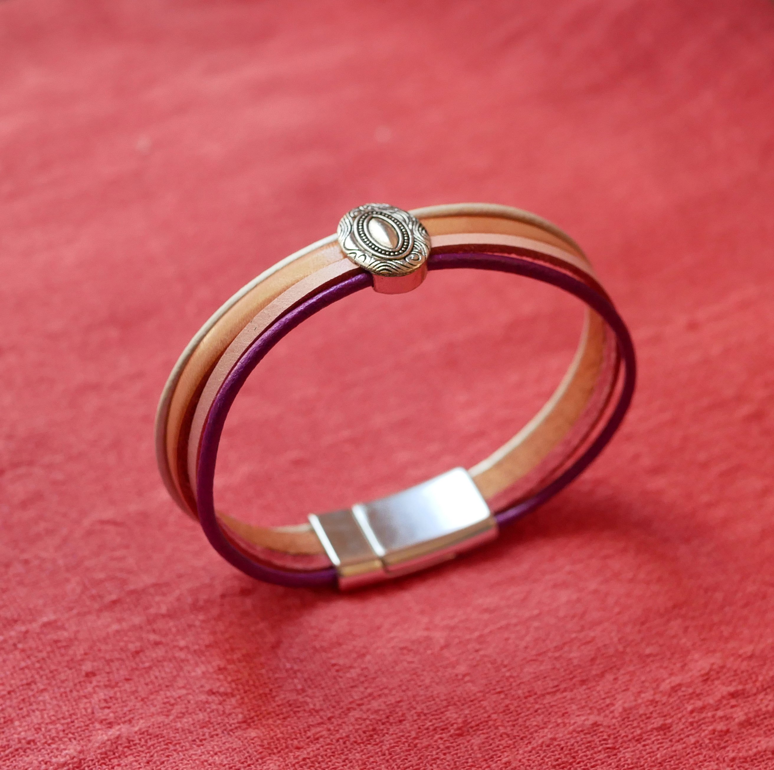 Zilveren medaillonarmband voor dames met 4 pastelleertjes 